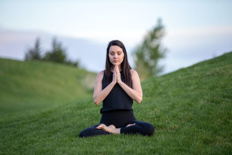 a woman with PCOS meditating